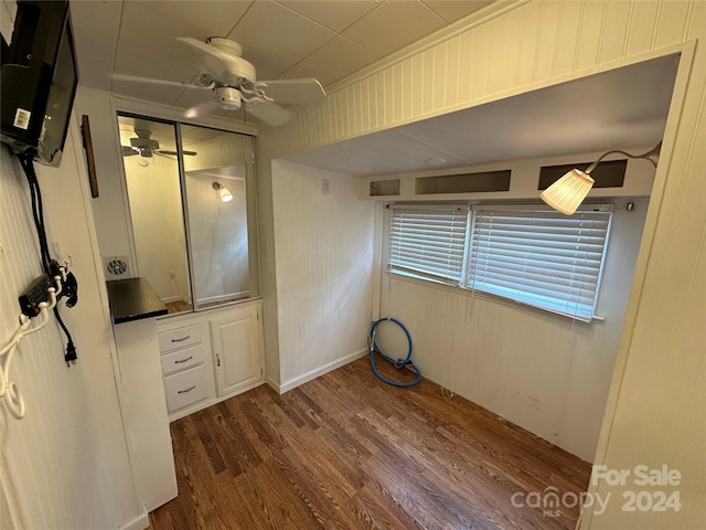 bathroom featuring ceiling fan and wood-type flooring