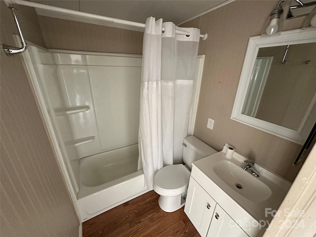 full bathroom with hardwood / wood-style floors, shower / bath combination with curtain, toilet, and vanity