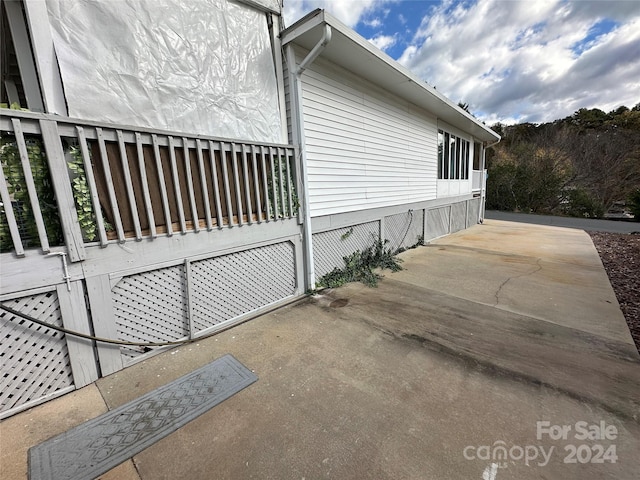 view of side of home featuring a patio