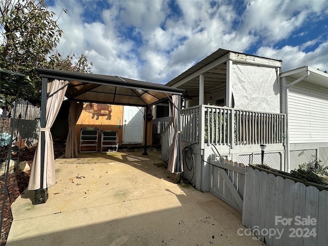 view of side of property with a gazebo