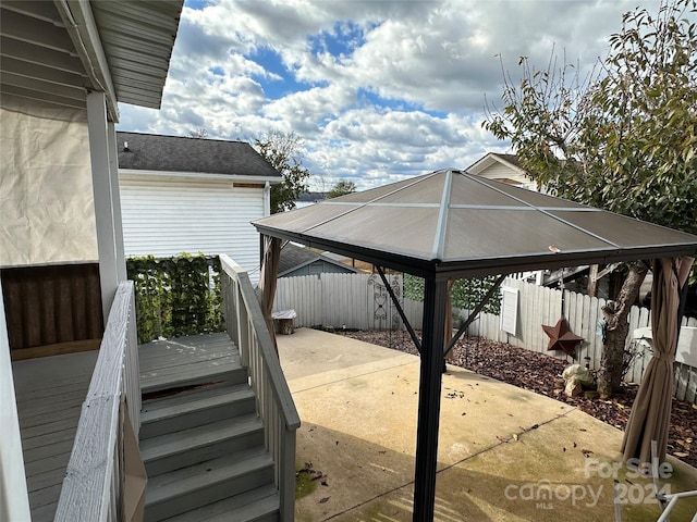 deck featuring a gazebo and a patio area