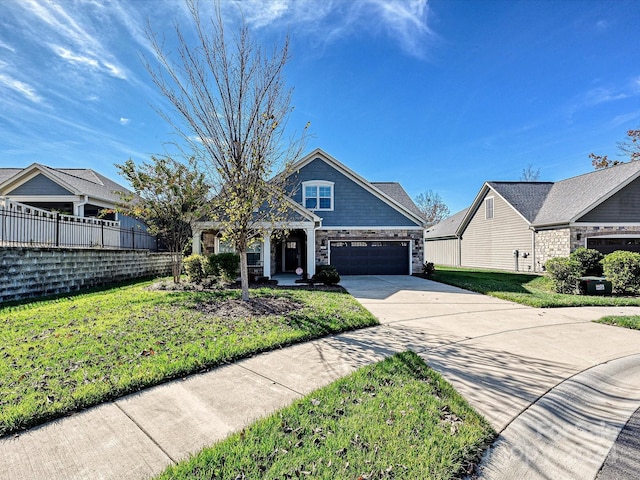 view of front facade with a garage and a front yard