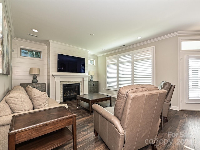 living room with ornamental molding, dark hardwood / wood-style flooring, and a healthy amount of sunlight