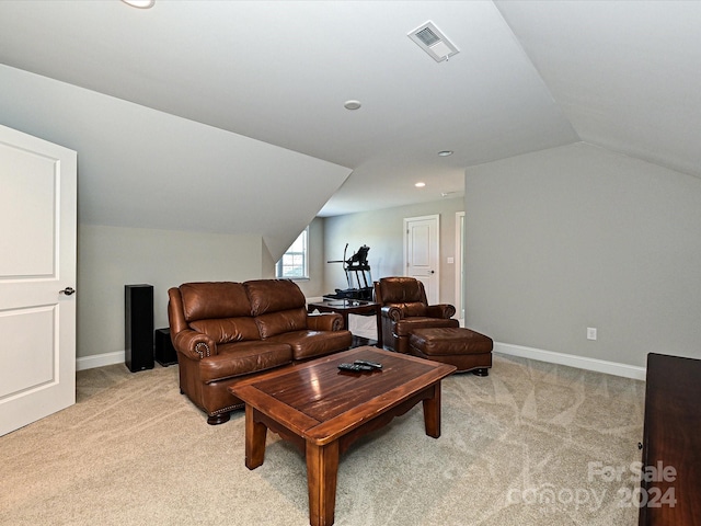 living room featuring light carpet and vaulted ceiling