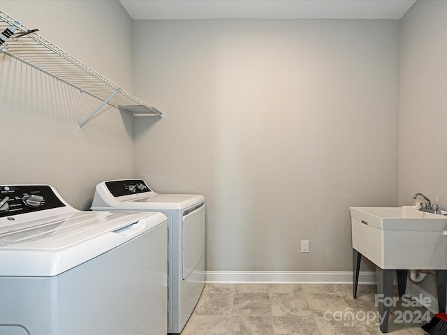 laundry area featuring washing machine and clothes dryer