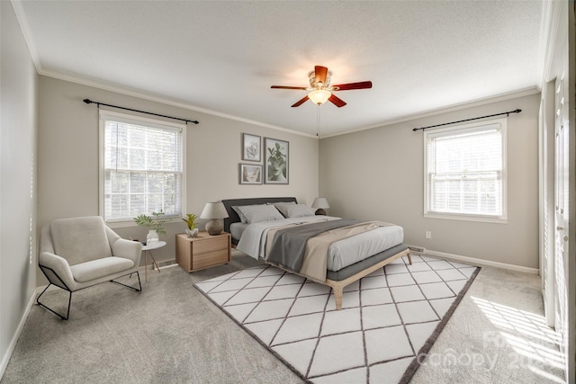 bedroom featuring ornamental molding, multiple windows, light colored carpet, and ceiling fan