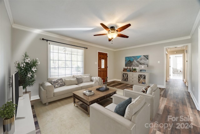 living room with ceiling fan, wood-type flooring, and ornamental molding