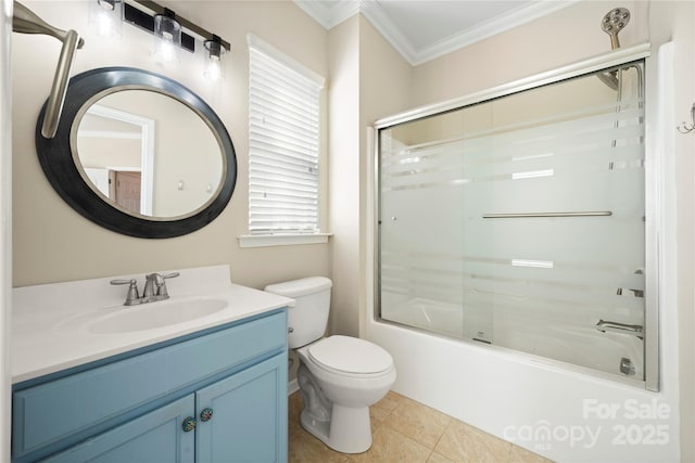 bathroom featuring enclosed tub / shower combo, toilet, vanity, tile patterned floors, and crown molding