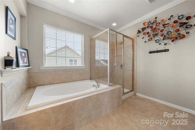 bathroom featuring a bath, a shower stall, crown molding, and tile patterned floors