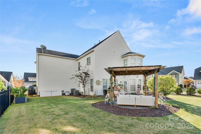 back of house with a lawn, outdoor lounge area, and a fenced backyard