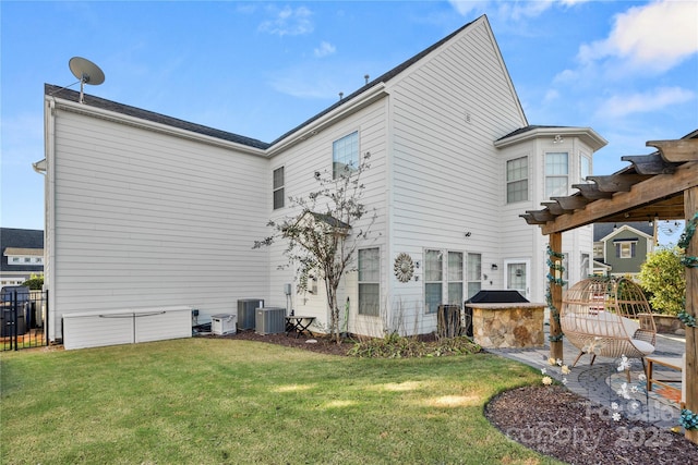 view of side of home with central air condition unit, fence, and a lawn