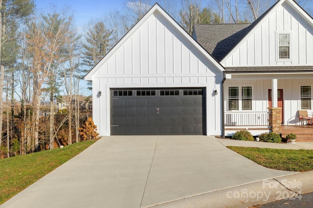 modern farmhouse style home with a porch and a garage