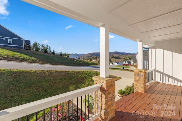 wooden deck featuring a mountain view