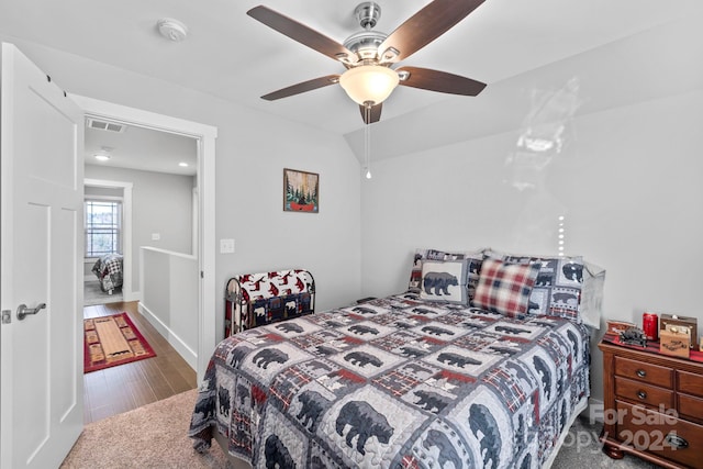 bedroom featuring ceiling fan and hardwood / wood-style flooring