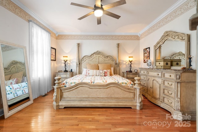 bedroom featuring ceiling fan, light hardwood / wood-style floors, and ornamental molding