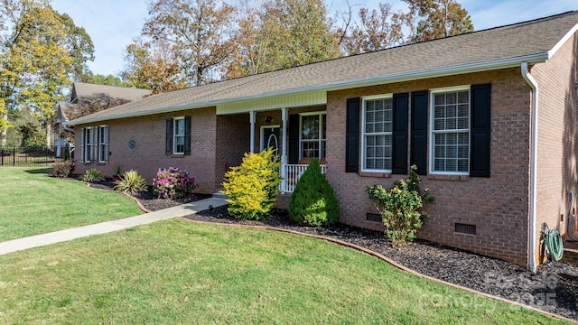 single story home with covered porch and a front yard