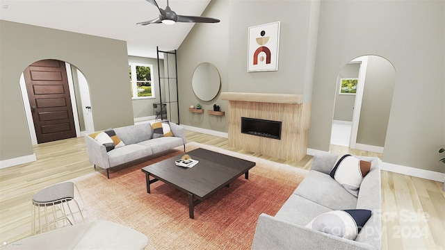 living room featuring high vaulted ceiling, wood-type flooring, and ceiling fan