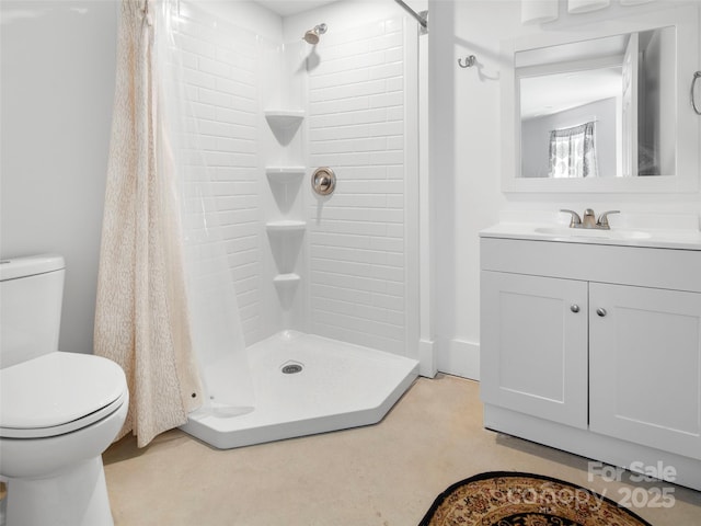 bathroom with toilet, vanity, and a shower with shower curtain