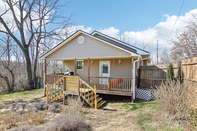 back of house featuring a deck