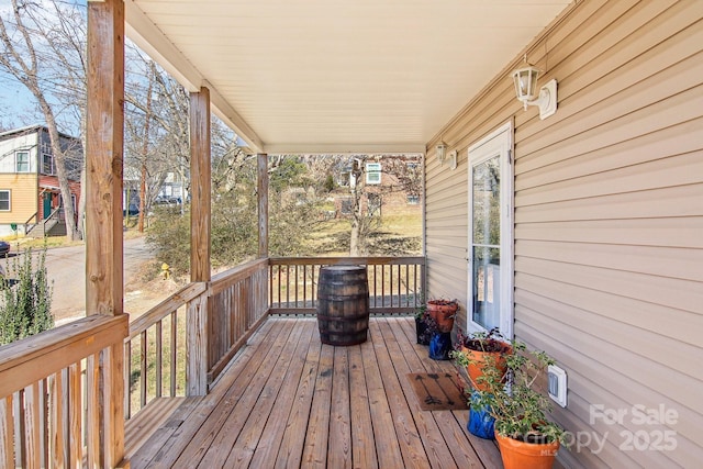 wooden deck featuring covered porch