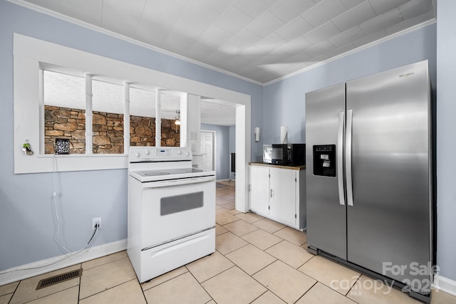 kitchen featuring crown molding, white cabinetry, electric stove, stainless steel refrigerator with ice dispenser, and a healthy amount of sunlight