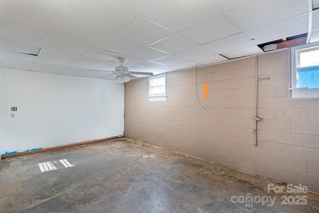 basement featuring a paneled ceiling