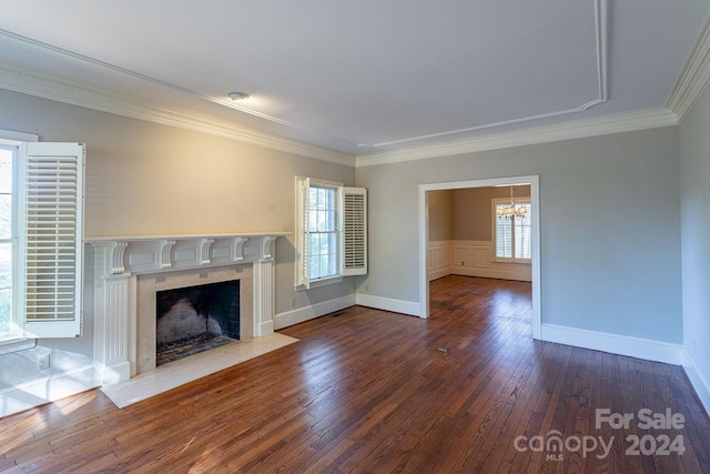 unfurnished living room with a high end fireplace, wood-type flooring, and crown molding