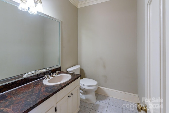 bathroom featuring tile patterned flooring, vanity, toilet, and ornamental molding