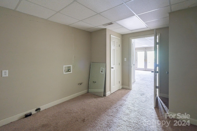 washroom with carpet, hookup for a washing machine, and french doors