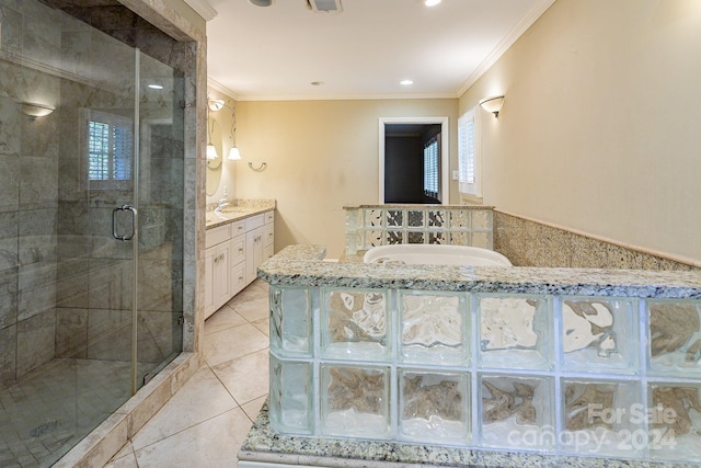 bathroom with tile patterned floors, vanity, an enclosed shower, and ornamental molding