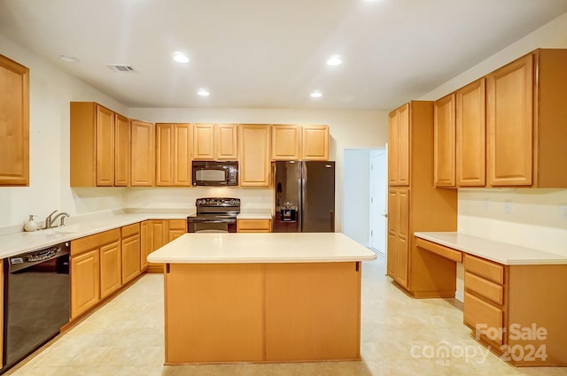 kitchen with black appliances, a kitchen island, and sink