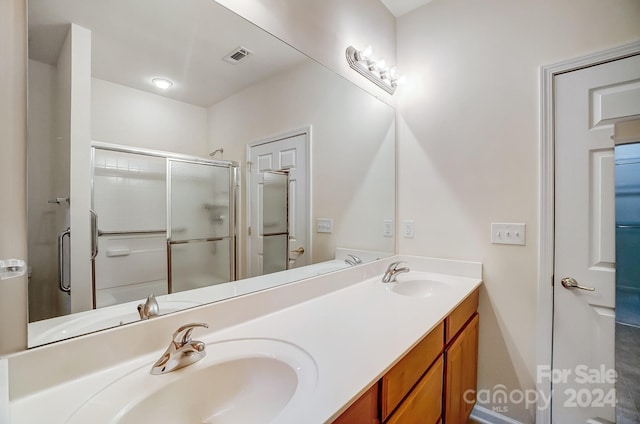 bathroom featuring vanity and walk in shower