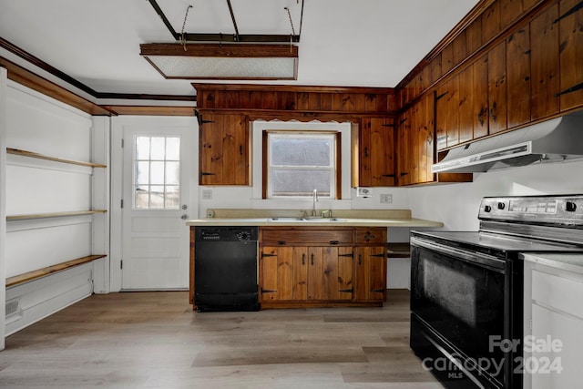 kitchen with sink, light hardwood / wood-style floors, and black appliances