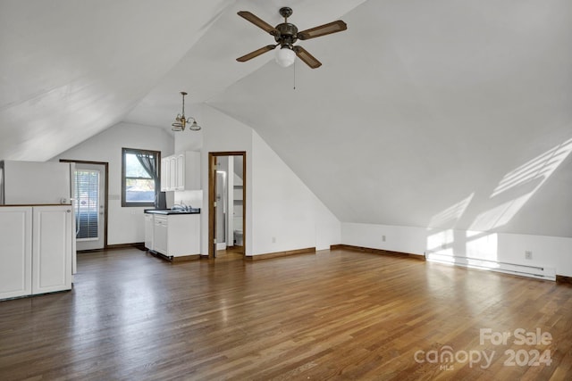 bonus room featuring ceiling fan, sink, dark hardwood / wood-style flooring, a baseboard heating unit, and vaulted ceiling