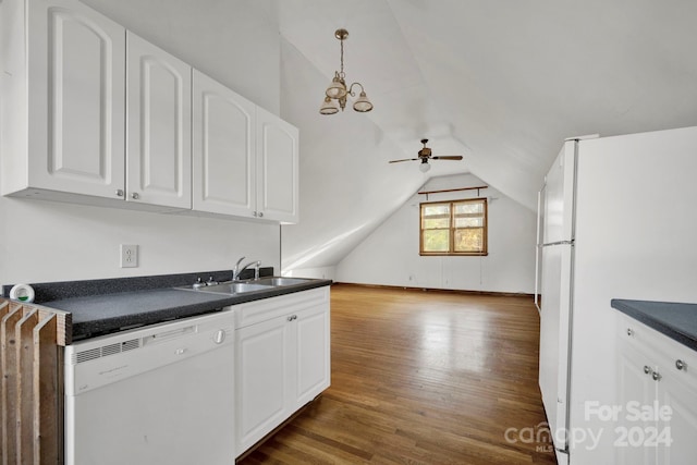 kitchen featuring white appliances, ceiling fan with notable chandelier, vaulted ceiling, sink, and white cabinets