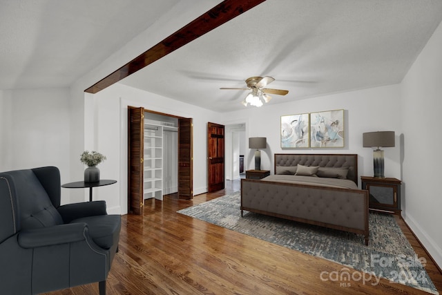 bedroom with ceiling fan and dark hardwood / wood-style flooring