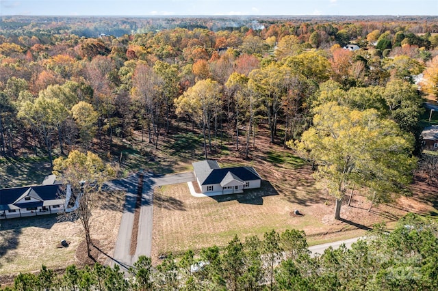 bird's eye view featuring a forest view