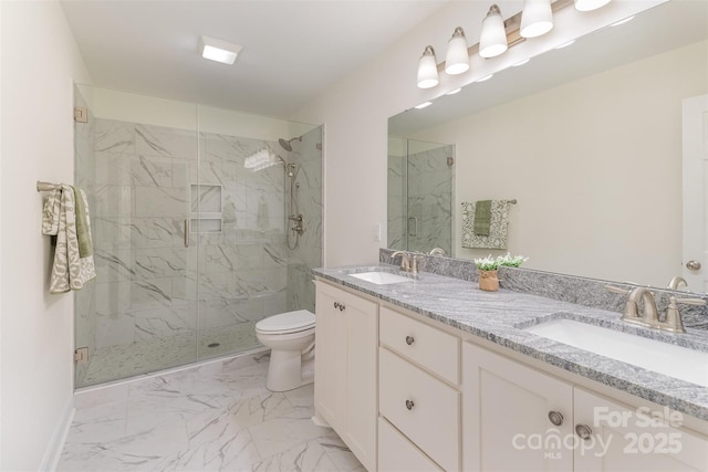 full bath featuring marble finish floor, a sink, a marble finish shower, and double vanity