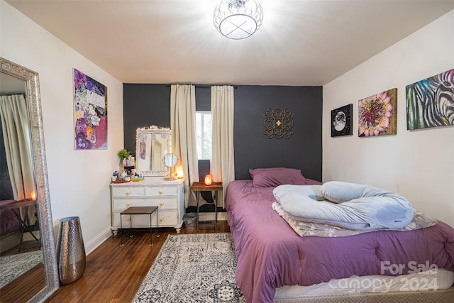 bedroom featuring dark hardwood / wood-style floors