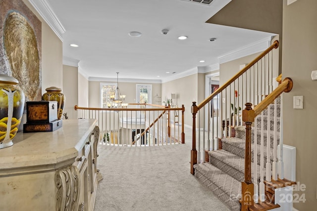 stairs with crown molding, carpet floors, and a notable chandelier