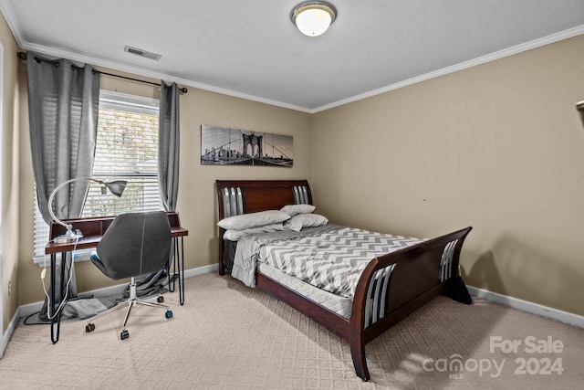 bedroom featuring crown molding and light colored carpet