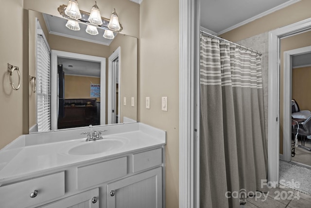 bathroom featuring vanity, tile patterned floors, and crown molding