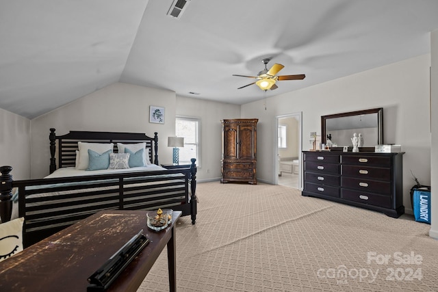 bedroom featuring connected bathroom, light colored carpet, vaulted ceiling, and ceiling fan