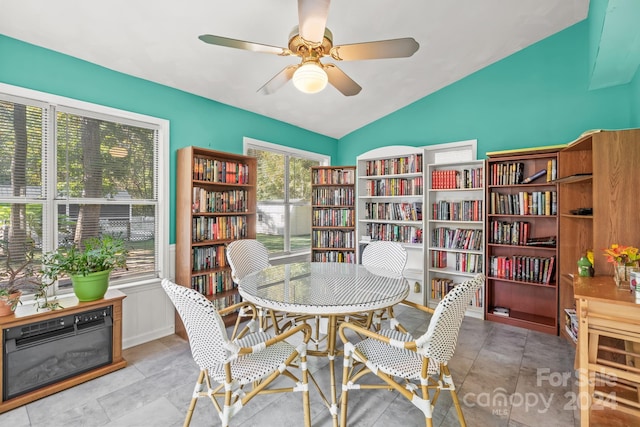 dining area with ceiling fan and vaulted ceiling