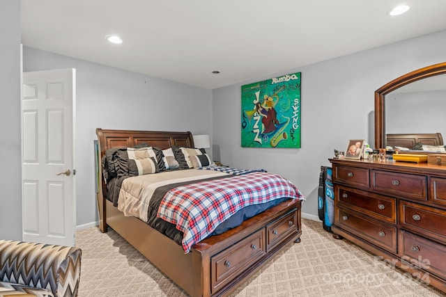 bedroom featuring light carpet