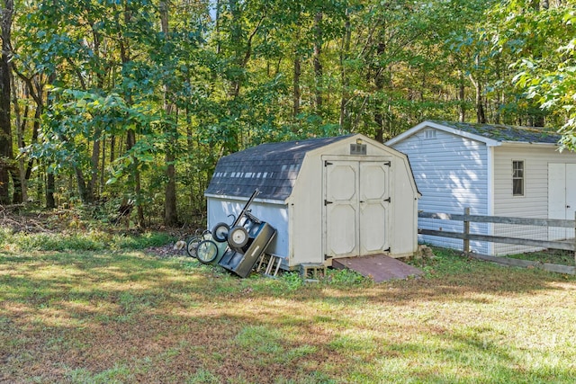 view of outbuilding featuring a lawn