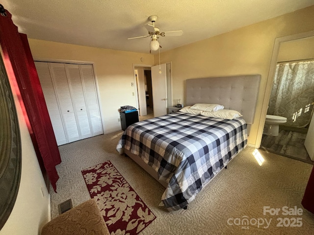 carpeted bedroom with ceiling fan, a closet, connected bathroom, and a textured ceiling