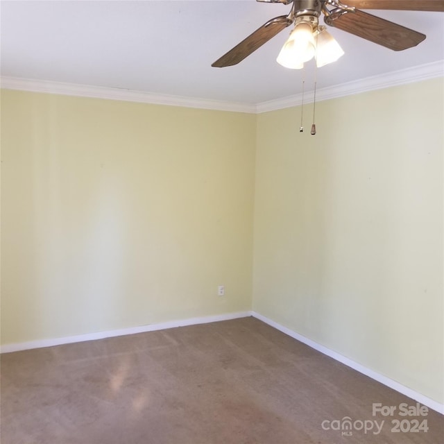 carpeted spare room with crown molding and ceiling fan