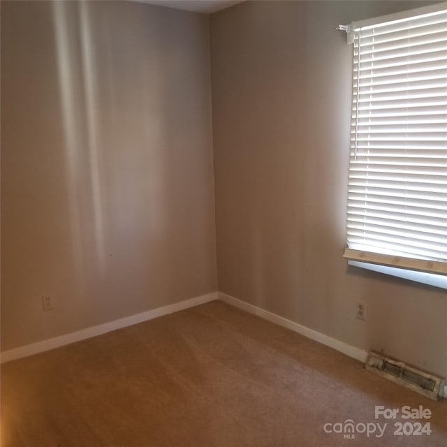 empty room featuring carpet flooring