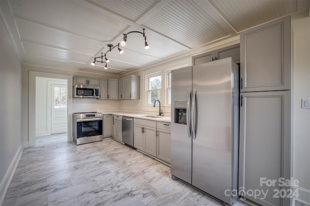 kitchen featuring stainless steel appliances, gray cabinets, and sink